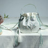 Embroidered Canvas Crossbody Bag with Tassels