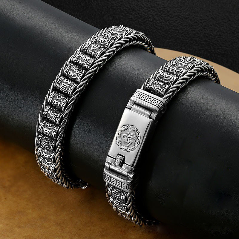 Silver tone copper bracelet with braided texture and engraved mantra beads