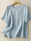 Light blue cotton V-neck t-shirt with floral embroidery on a hanger