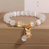 Cat's Eye Charm Bracelet with Flower, Bear and Swan