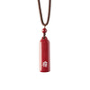 Red cylindrical cinnabar pendant with white Sanskrit script on a brown cord