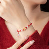Handmade Peach Blossom Red Rope Bracelet with Gold-Tone Flower