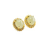 Pair of natural Hetian jade stud earrings with gold-tone halo setting on white background