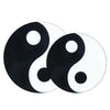Two round wooden pendants with black and white Yin Yang designs on a white background
