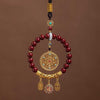 Circular car hanging ornament with red cinnabar beads and gold-tone charms