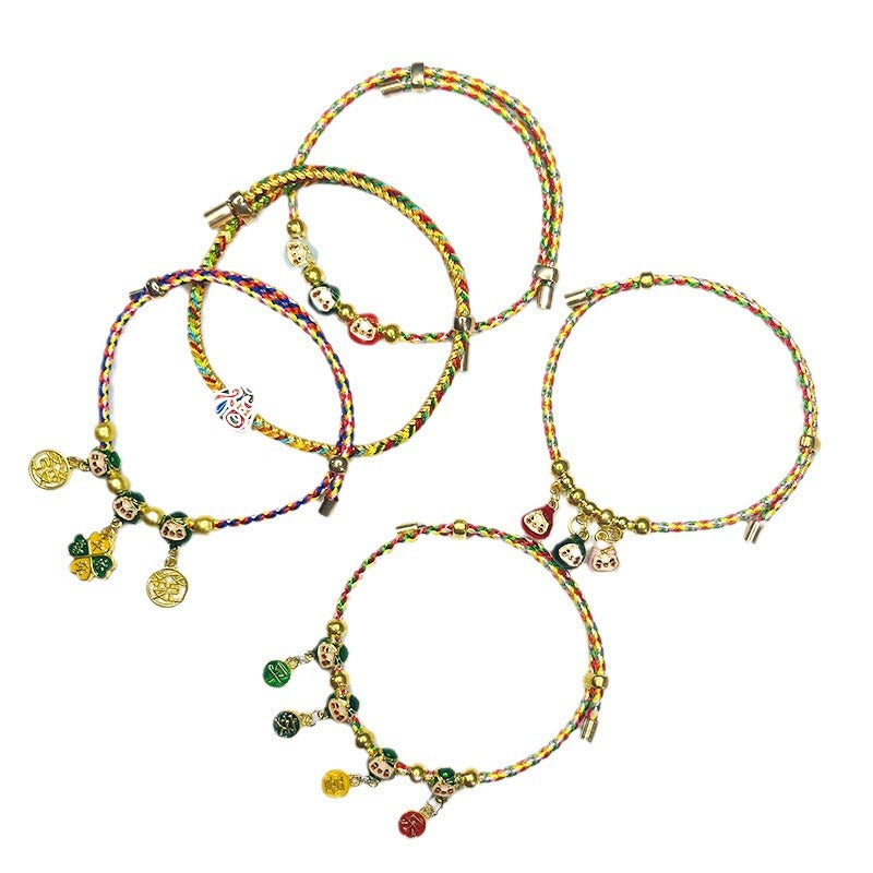 A collection of multicolored woven bracelets with gold-tone zongzi and coin charms