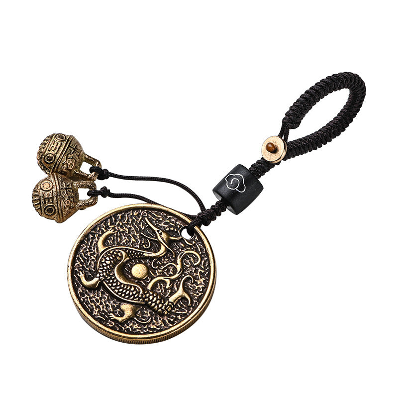 Round brass pendant with Azure Dragon relief on black cord