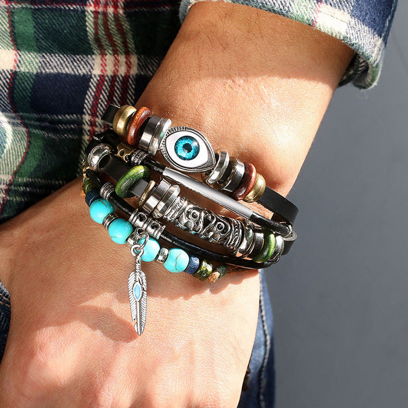 Multi-layer leather bracelet with blue evil eye charm and turquoise beads on wrist