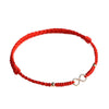 Red braided bracelet with silver infinity charm on white background