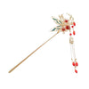 Gold tone metal hair stick with butterfly and red bead tassels