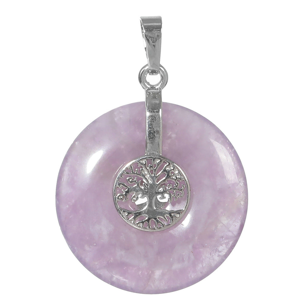 Silver tone Tree of Life charm centered on a polished pink Rose Quartz donut pendant