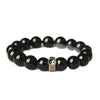 Black obsidian beaded bracelet with gold-tone yin yang charm