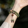 Green Sandalwood Bracelet with Hand-Tied Knots and Bead Tassels