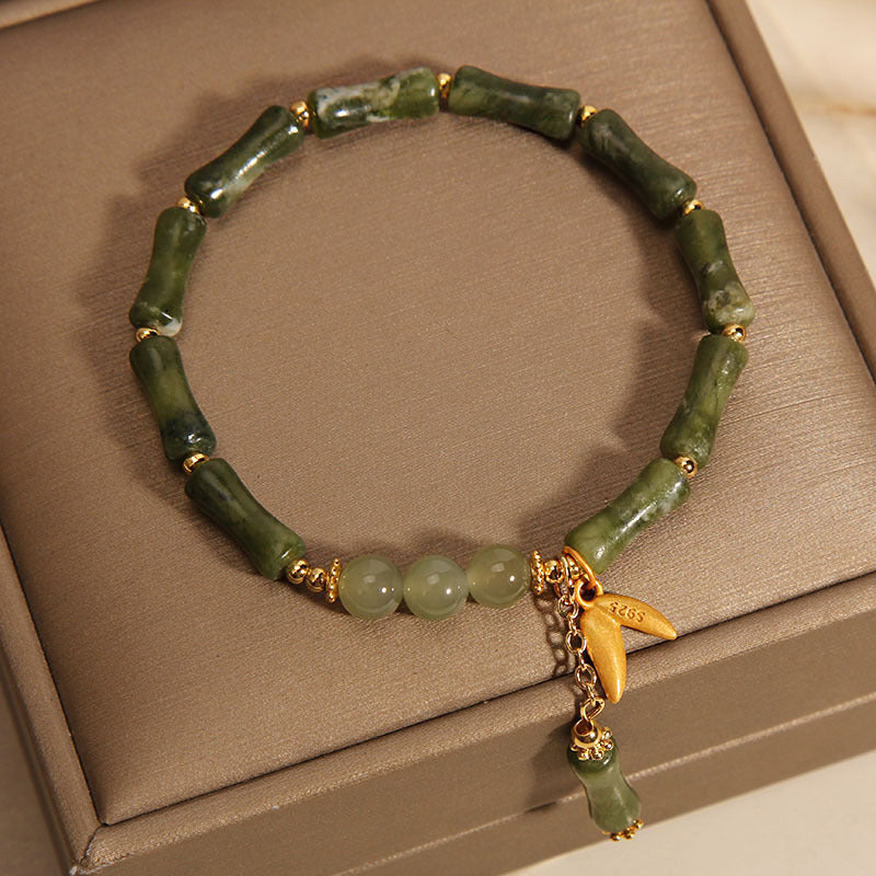 Green bamboo jade leaf pattern wealth luck bracelet with gold tone accents