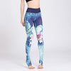 Women wearing high-waisted yoga leggings with a green lotus flower watercolor print