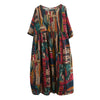 Woman wearing a colorful graphics midi dress with half sleeves and a loose fit