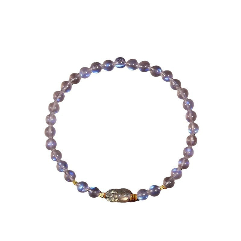 Round blue moonstone beads on a stretch cord with a central gold Pixiu charm