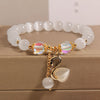 Cat's Eye Charm Bracelet with Flower, Bear and Swan
