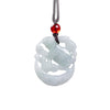 Close up of white jade rabbit pendant carved in openwork style on a dark cord
