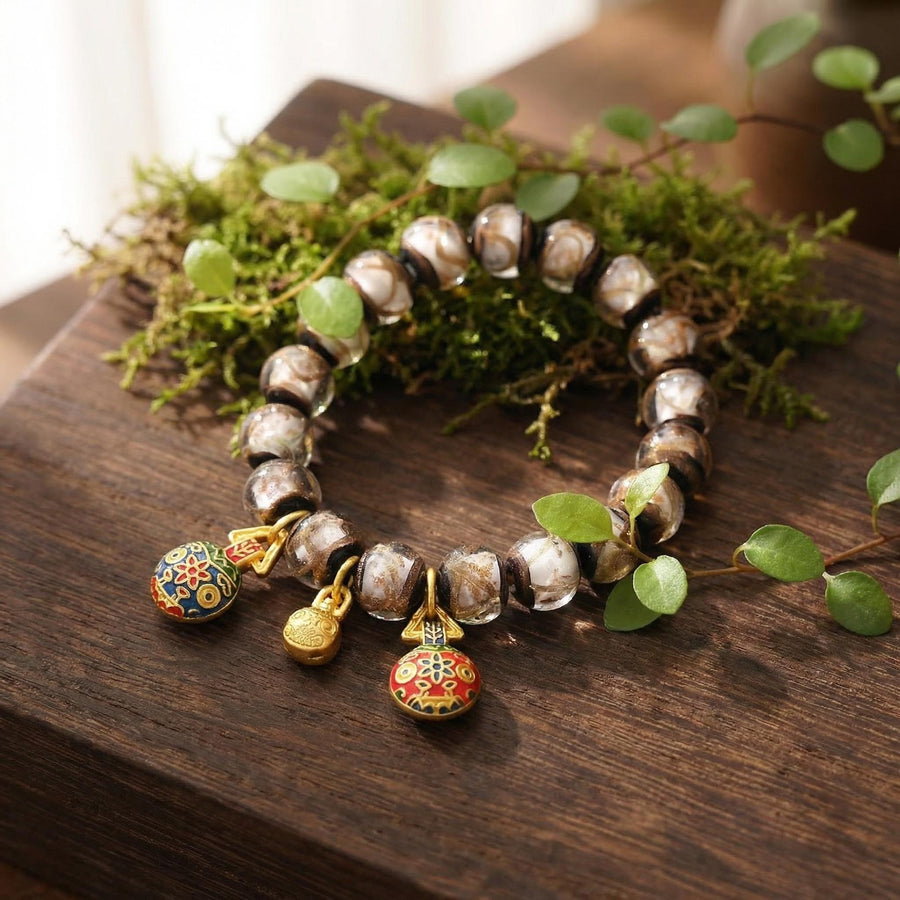 Swallowing Beast Liuli Glass Bead Bracelet with Gold Tone Charms