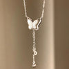 Silver-Tone Butterfly Necklace with White Shell and Tassel