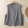 Grey cotton linen sleeveless vest with V-neck and buttons on a hanger