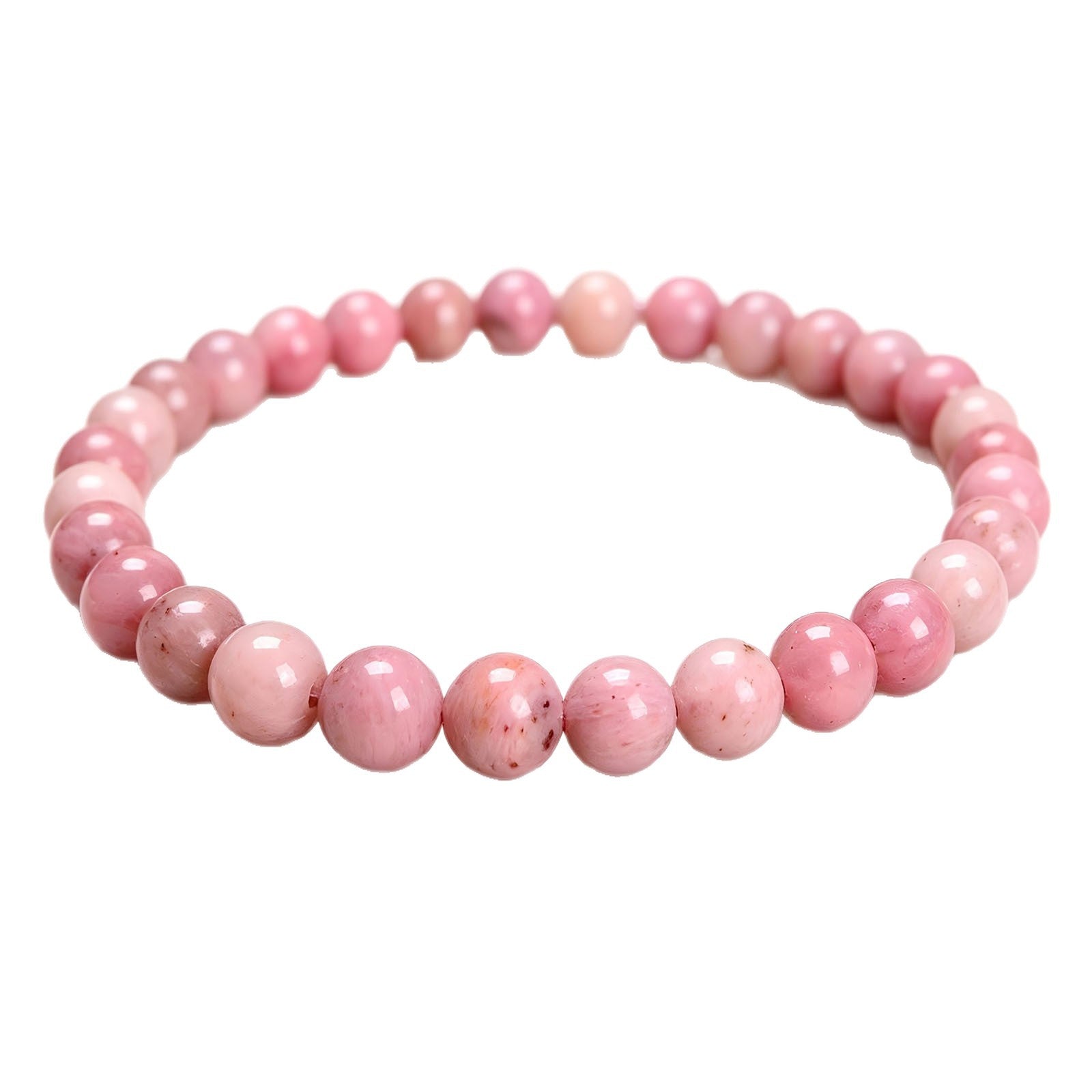 Close-up of a pink rhodochrosite beaded stretch bracelet on a white background