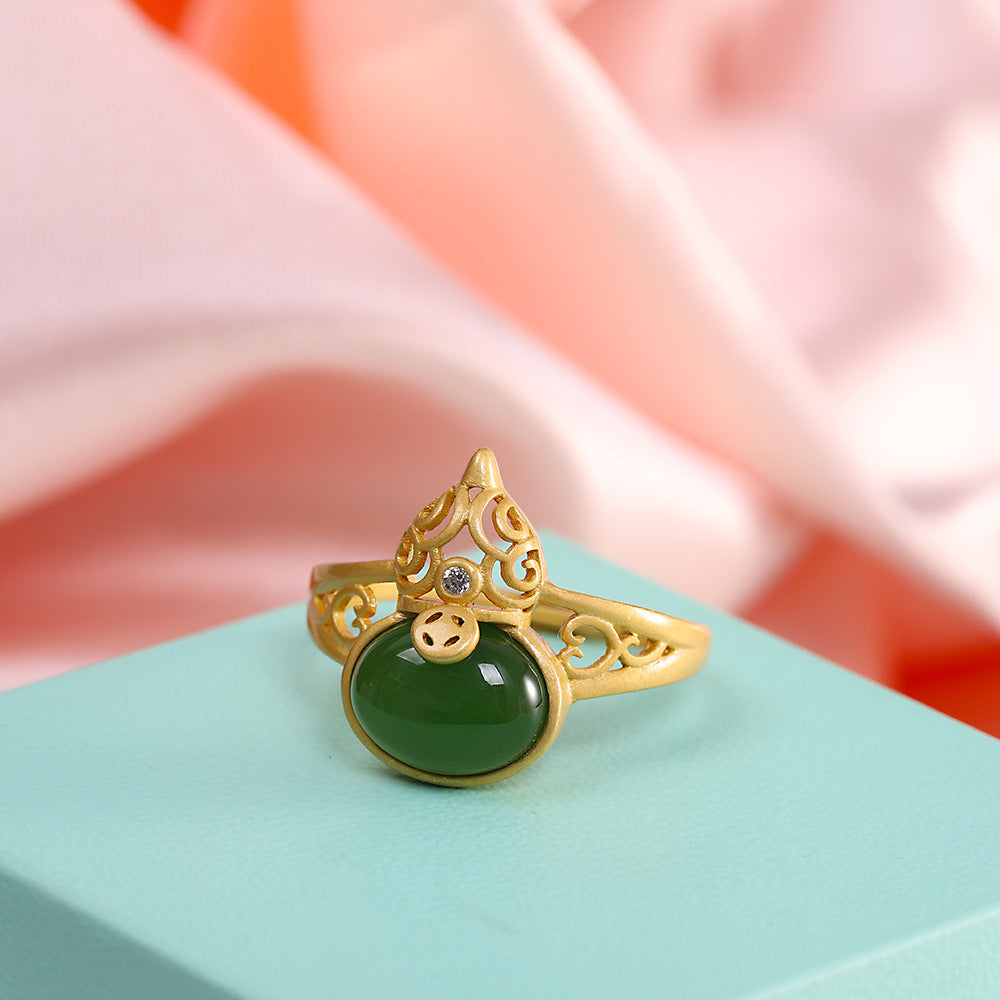 Gold plated copper ring with green jade stone and gourd charm