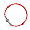 Close up view of a handmade silver Ruyi charm on a red braided cord bracelet