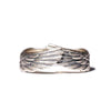 Close up of silver-tone adjustable ring with angel wing texture on white background
