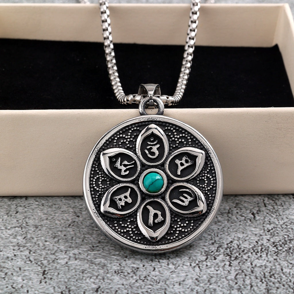 Round stainless steel pendant with six-syllable mantra petals and a blue turquoise center stone on a box chain