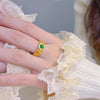 Gold-Tone Filigree Ring with Green Stone