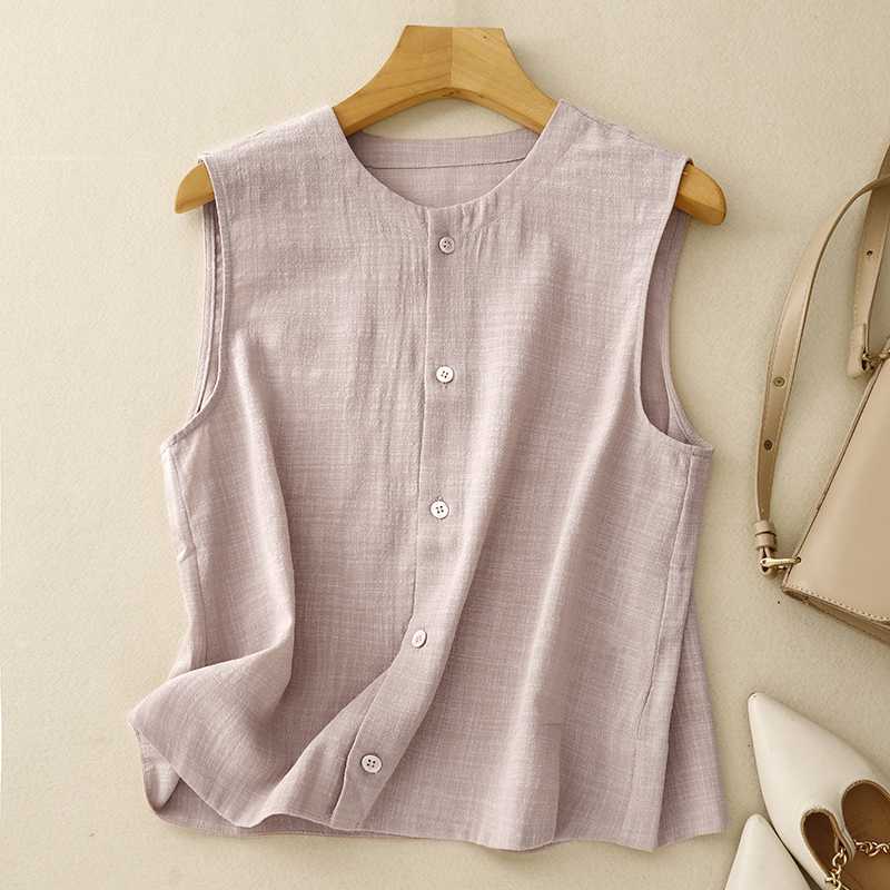 Pink sleeveless button-up shirt on a wooden hanger