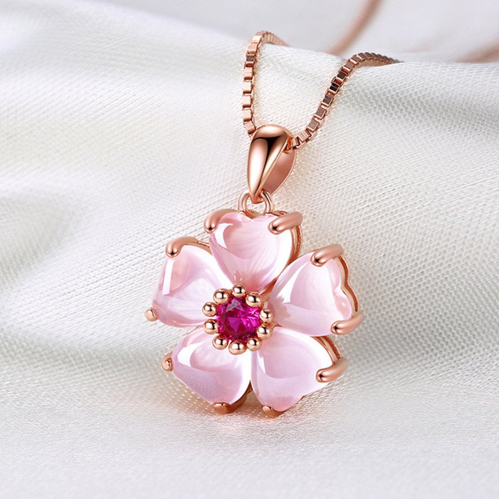 Close up of pink crystal flower pendant on chain