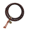 Double loop bodhi seed bracelet with brown cord and gold-tone charm