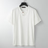 White men's short sleeve henley shirt hanging on a hanger