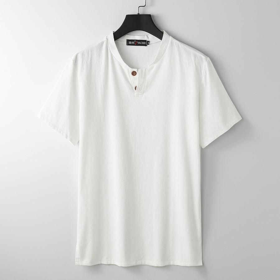 White men's short sleeve henley shirt hanging on a hanger