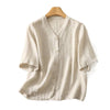 Beige linen blend short sleeve shirt with buttons on a hanger