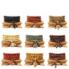 A stack of 108 wood mala beads wrapped around a wooden stand