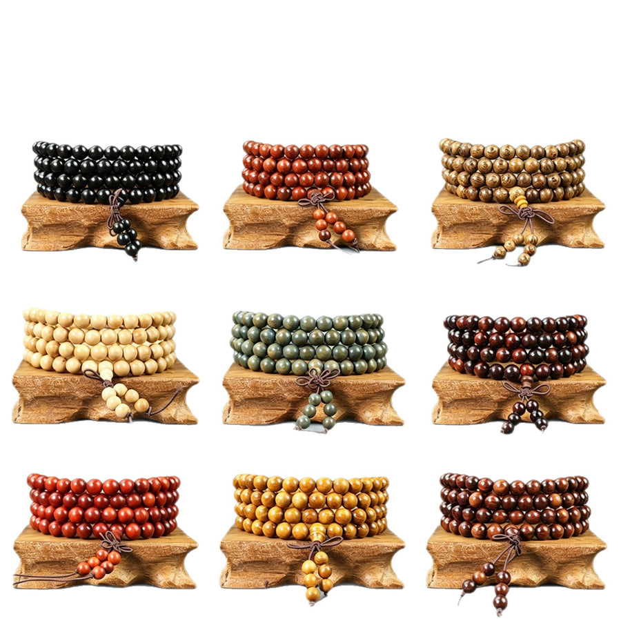 A stack of 108 wood mala beads wrapped around a wooden stand