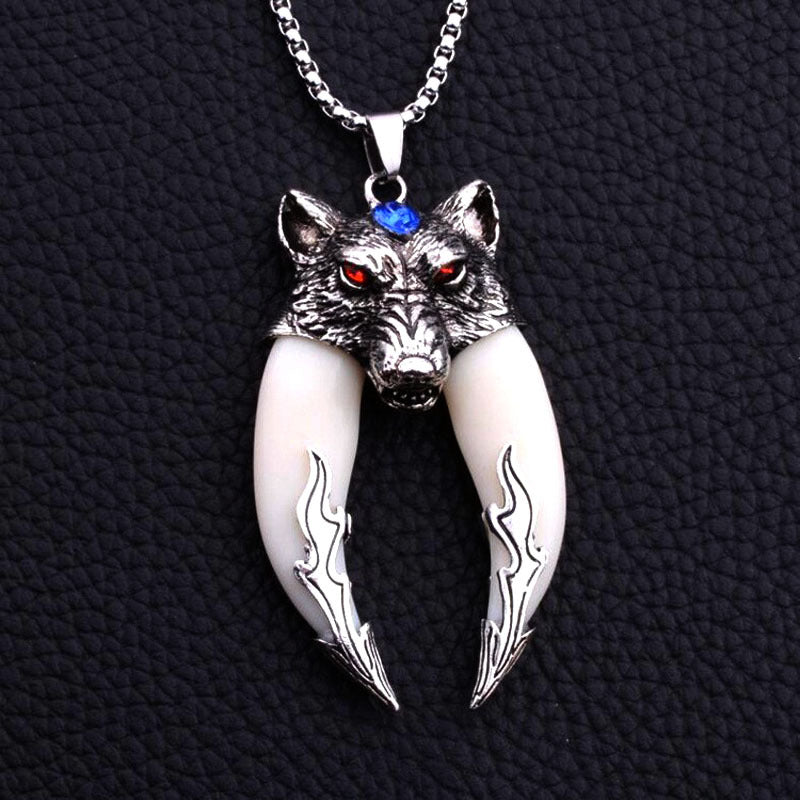 Silver tone necklace with an imitation white wolf tooth pendant and a wolf head charm