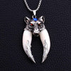 Silver tone necklace with an imitation white wolf tooth pendant and a wolf head charm