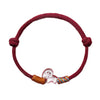 Model wearing a red string bracelet with a silver sheep charm