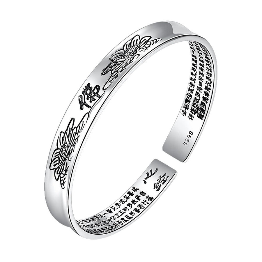Silver-tone open cuff bracelet with engraved lotus flowers and Chinese script