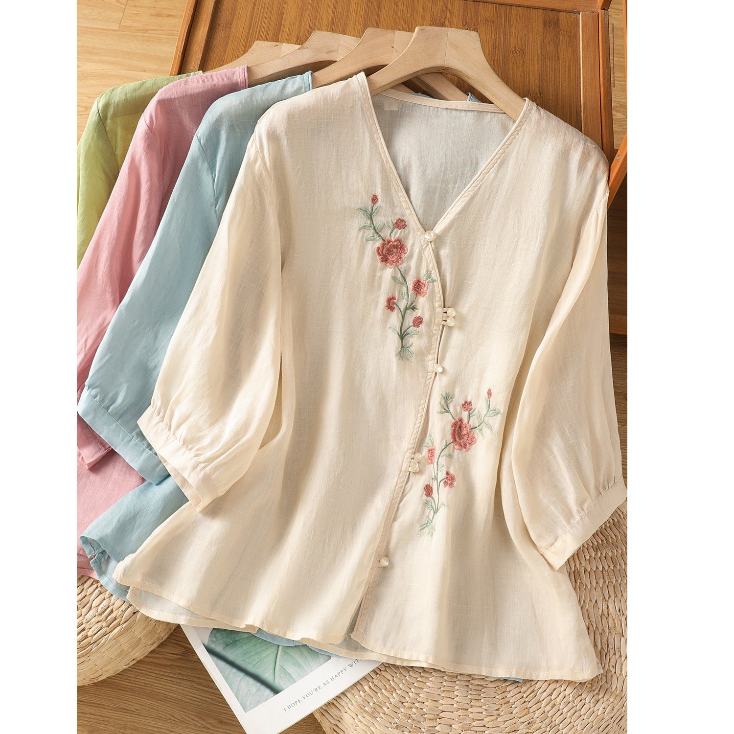 Apricot women's V-neck shirt with pink floral embroidery and pearl buttons
