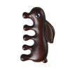 Close up of a wooden rabbit shaped massage comb with blue eyes