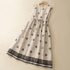 Beige sleeveless linen dress with black geometric pattern and drawstring waist