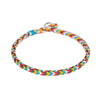 Close up of the colorful braided cord and metal clasp on a red background