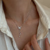 Silver-Tone Butterfly Necklace with White Shell and Tassel