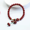 Cinnabar Rose Bracelet with Gold-Tone Accents